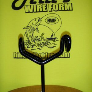 A black wire holder with a fish on it.