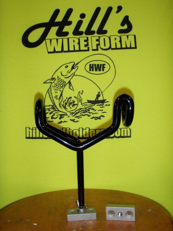 A black wire holder with a fish on it.