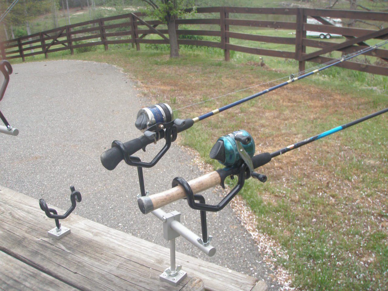 A couple of fishing rods on the ground.