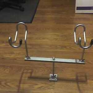 A pair of metal hooks on the ground.