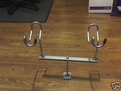 A pair of metal hooks on the ground.