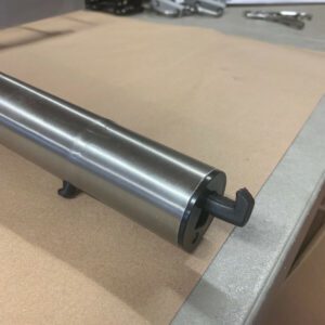 A metal roller on top of a table.