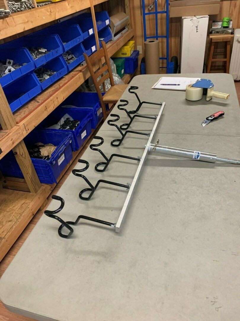A rack with many hooks on the floor