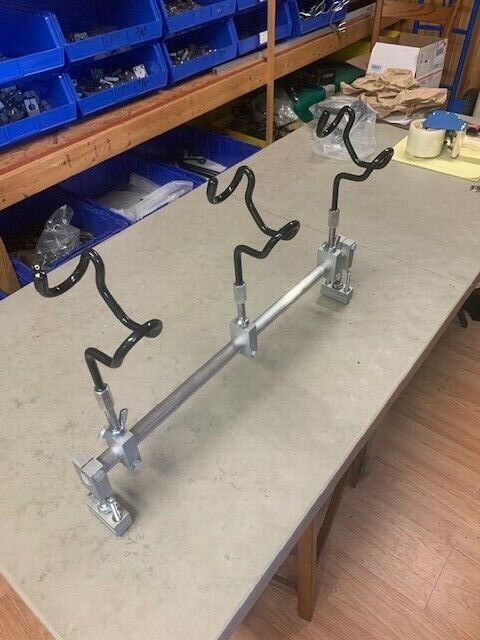 A table with some metal pipes on it