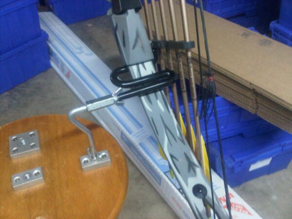 A pair of wooden skis and some poles