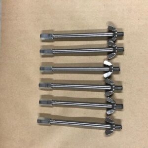 A group of eight wrenches sitting on top of a table.