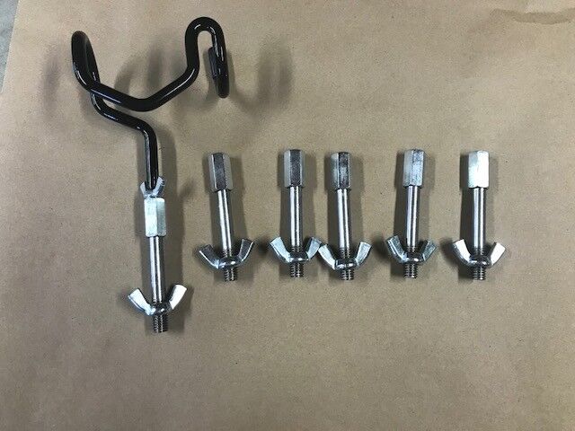 A set of six different sized metal clamps.