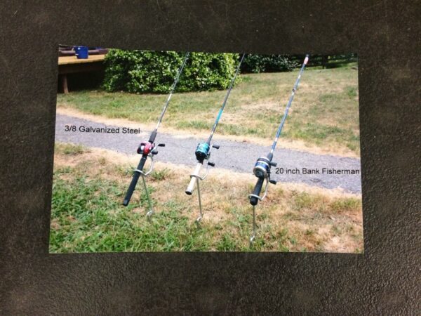 Three fishing rods are attached to a pole.