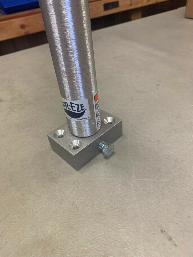 A metal pole with a small metal base.