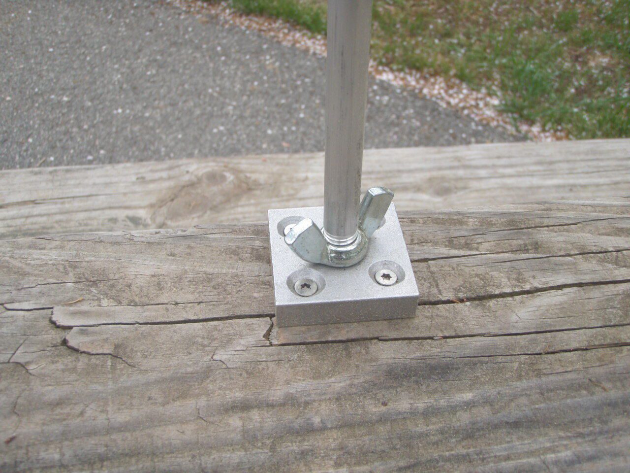 A close up of the base on a wooden deck