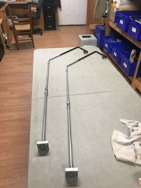 A pair of poles are sitting on the floor.