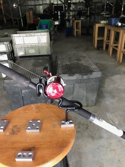 A large metal object sitting on top of a wooden table.