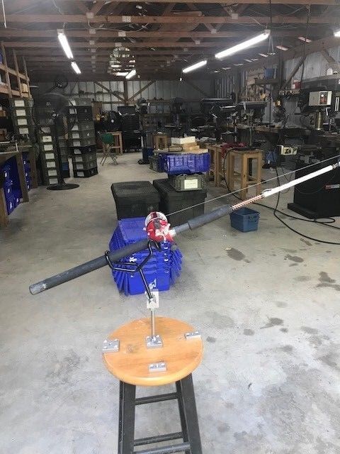 A large metal pole sitting in the middle of a room.