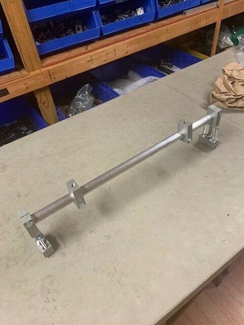 A metal bar sitting on top of a table.