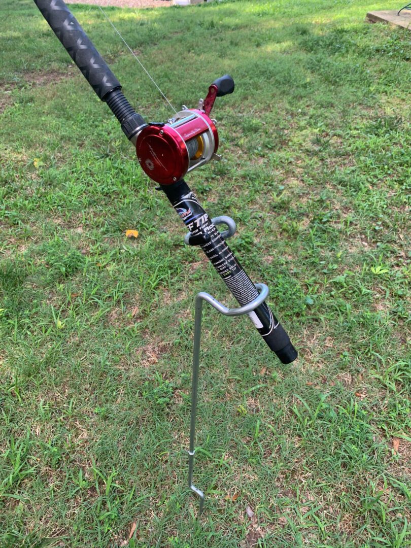 A fishing rod is attached to the ground.