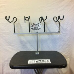 A table with four metal hooks on it.