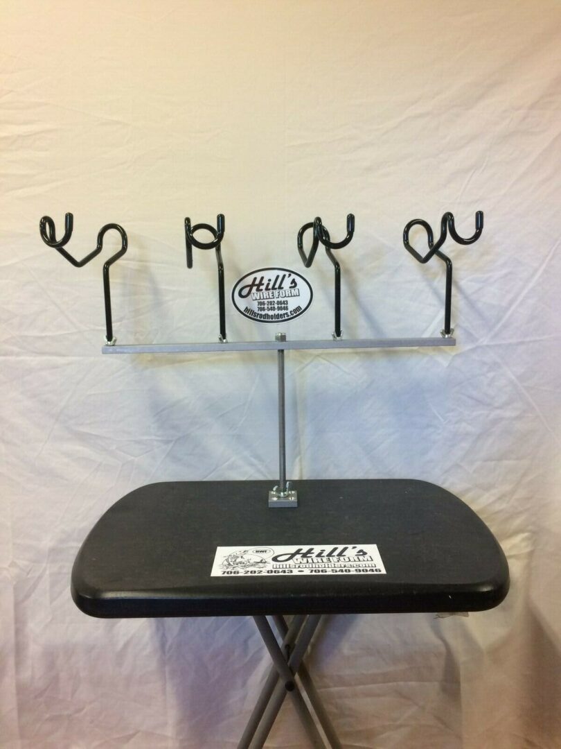 A table with four metal hooks on it.