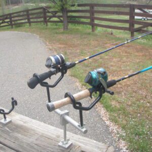 A couple of fishing rods on the ground.