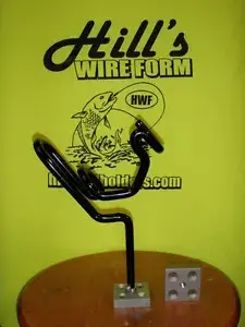 A black wire holder sitting on top of a table.