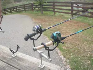A couple of fishing rods on the ground.